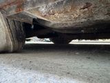 a close up of a car ' s tire on the ground