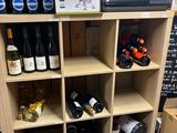 many bottles of wine on the shelves in the store