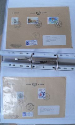 two binders with stamps on them sitting on a table