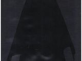 a black and white photo of a man in a cloak