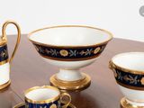four cups and saucers sitting on a table