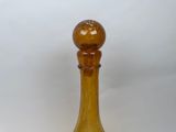 an image of a glass bottle with a wooden stopper
