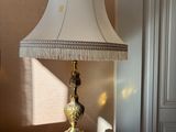 a lamp that is sitting on a table in a room