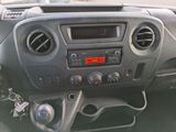 a dashboard of a car with a clock and a radio
