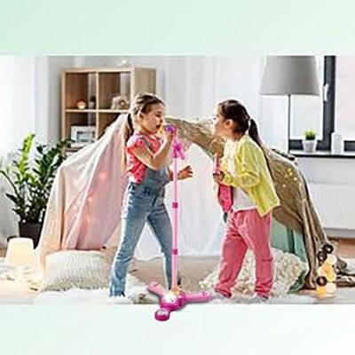 two young girls playing with a scooter in the living room