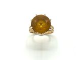 a close up of a ring with a citrine stone in it