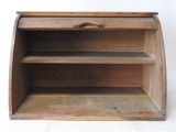 a small wooden shelf with a drawer on it