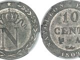 a close up of a coin with the number one on it