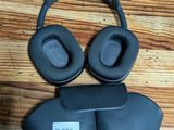a pair of headphones sitting on top of a wooden floor