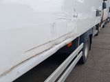 a white truck that is parked in a parking lot