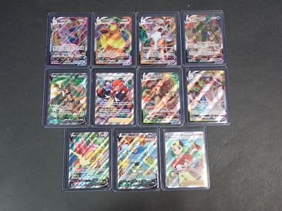 beaucoup de cartes pokemon différentes sur la table
