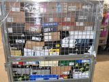 a metal cart with many items in it in a warehouse