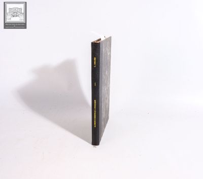 a black book that is sitting on a white surface