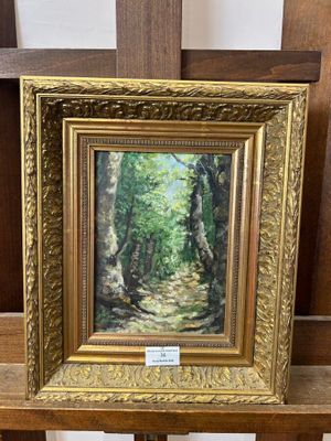 an oil painting of a path in the woods by a wooden easel