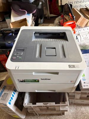 a printer that is sitting on top of a pile of boxes