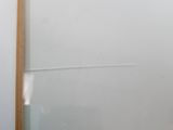 a picture of a bathroom with a glass shower door