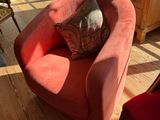 a red chair and a red chair in a living room