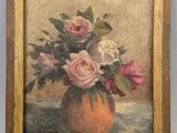 painting of roses in a vase on a table with a blue background