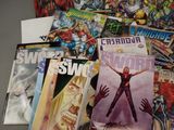 a lot of comic books on the table together
