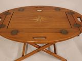 a wooden tray with a star on it on a stand