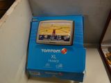 a blue box with a gps device on top of it