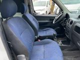 a blue seat in the back of a small car
