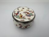 an image of a small white box with a bird design on it
