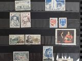 a lot of stamps that are on display in a case