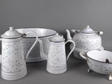 a white and blue tea set with a bowl and a bowl