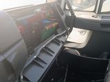 a view of the dashboard of a truck from the driver ' s seat