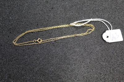 a close up of a necklace with a tag attached to it