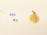 a gold coin with a picture of a woman on it