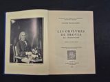 an open book with a picture of a man sitting at a desk
