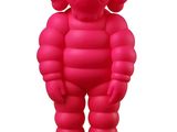 pink inflatable figure of a man standing on a white surface