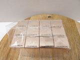 six boxes of cigarettes sitting on a wooden table