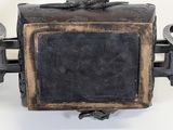 a small black box with a bird on top of it