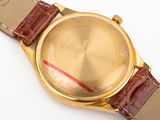 an image of a close up of a wrist watch on a white surface