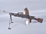 a toy gun that is sitting on a tripod