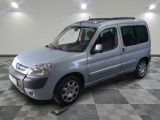 a picture of a silver van parked on a checkered floor