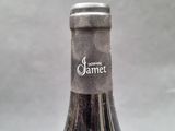 a close up of a bottle of wine on a table