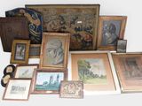 a lot of framed pictures and pictures on the floor