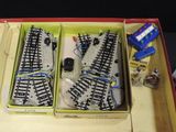 two train tracks in a box with a remote control