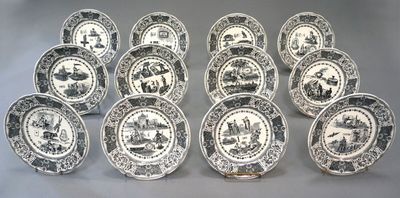 twelve black and white plates with a picture of people on them