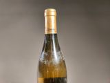 a bottle of wine that is sitting on a table