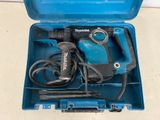 a blue tool box with a hammer and other tools in it