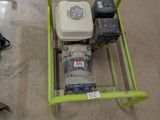 a small green cart with a water pump on the floor