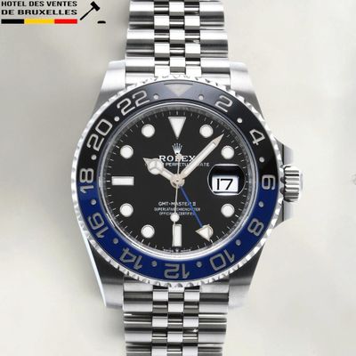 a close up of a wrist watch with a black and blue dial