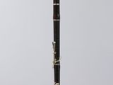 a close up of a black and gold pen on a clear stand