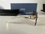 christian dior eyeglasses with box and case on table