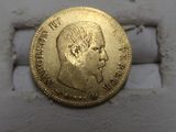 an image of a gold coin with a man ' s face on it